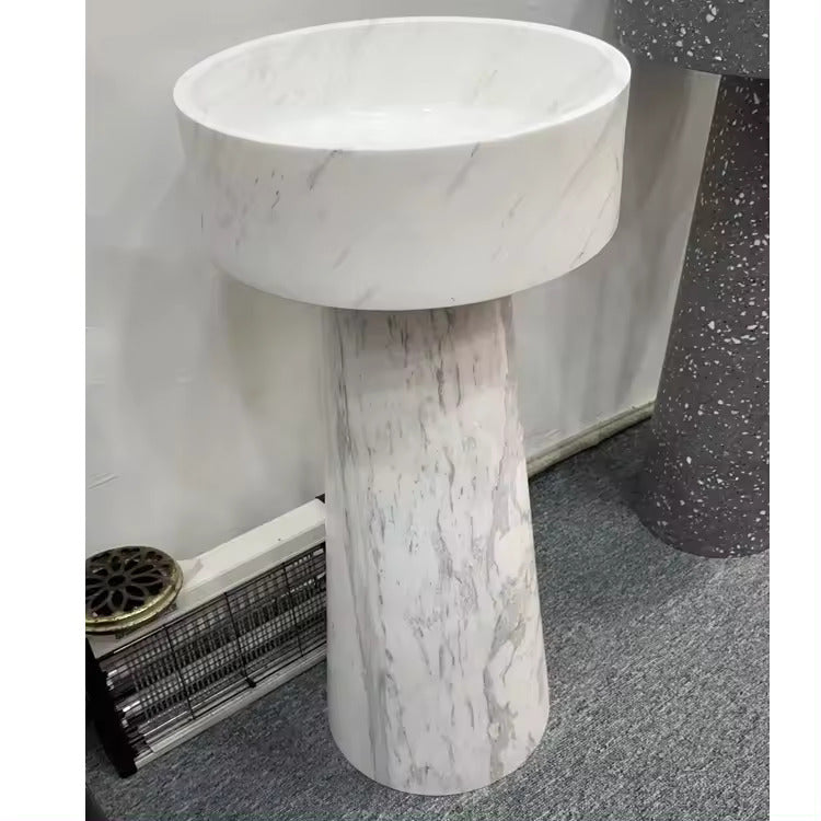 A round Mushroom - Standing Marble Basin Sink from Lise Luxury with a dark veined pattern exudes elegance and luxury.