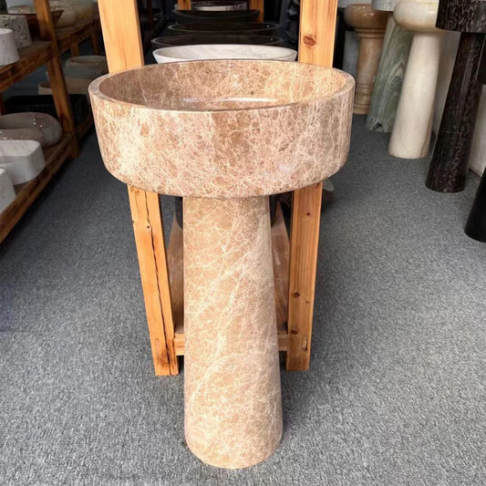 A round Mushroom - Standing Marble Basin Sink from Lise Luxury with a dark veined pattern exudes elegance and luxury.