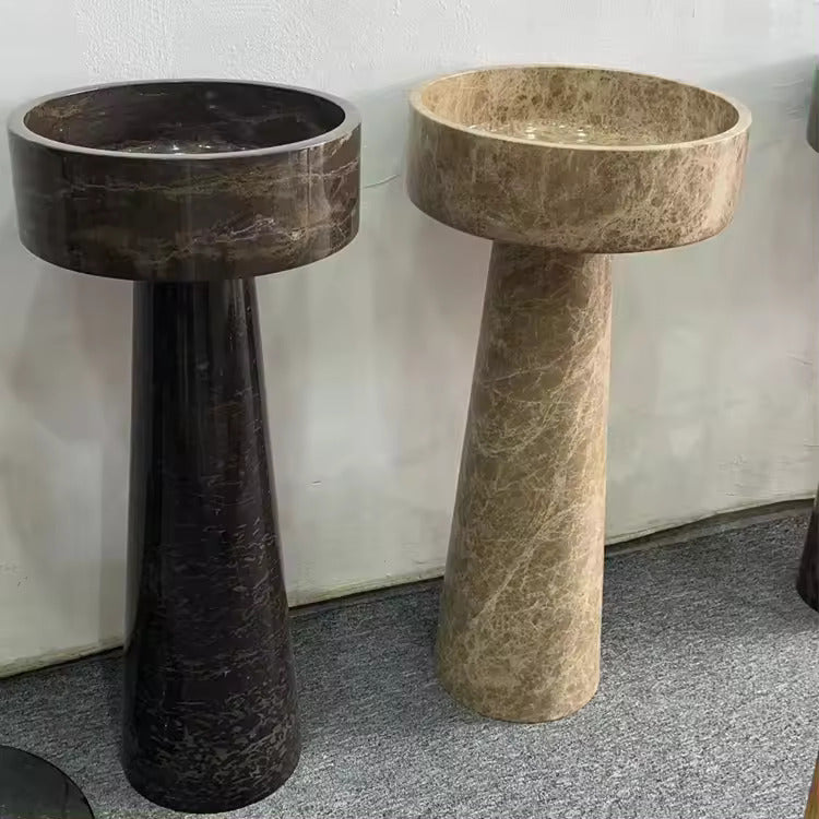 A round Mushroom - Standing Marble Basin Sink from Lise Luxury with a dark veined pattern exudes elegance and luxury.