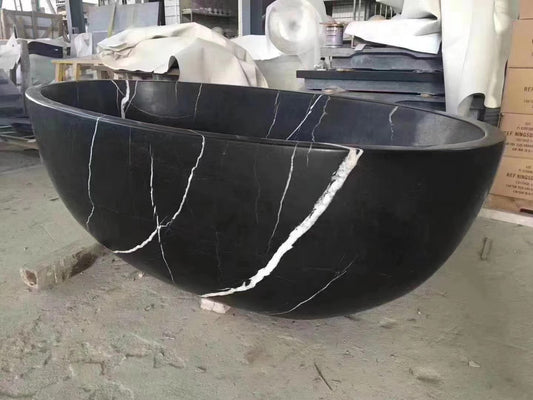Luxury large Lise Luxury Black Marble Bathtub with distinctive white veining.