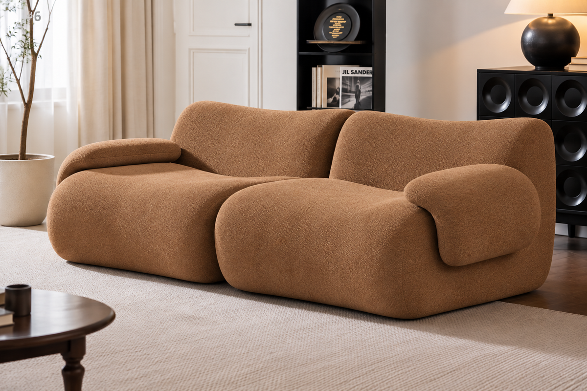 A modern, rounded modular sofa upholstered in a textured brown fabric, styled in a contemporary living room setting.