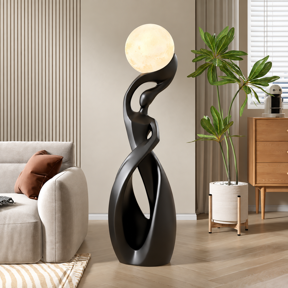 Modern floor lamp in a living room setting with a sofa and plant.