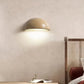 Sparkling Stella half-dome wall light by Lise Luxury illuminating a bedroom wall with a warm glow.
