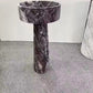 A round Mushroom - Standing Marble Basin Sink from Lise Luxury with a dark veined pattern exudes elegance and luxury.