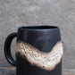 Black River contemporary black mug with an organic shape and ergonomic handle