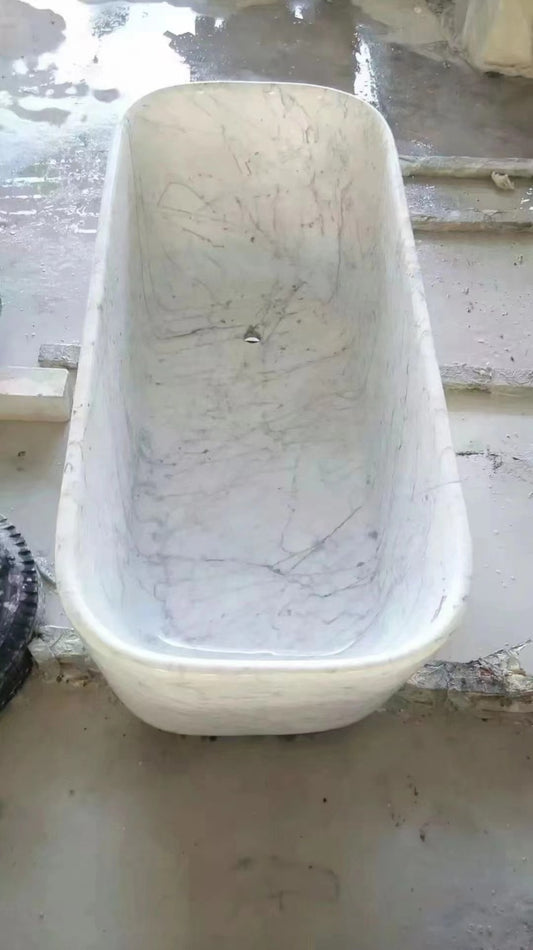 Lise Luxury marble bathtub with visible veins and a luxury design, positioned on a dusty floor.