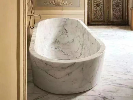 oval white marble bath tub