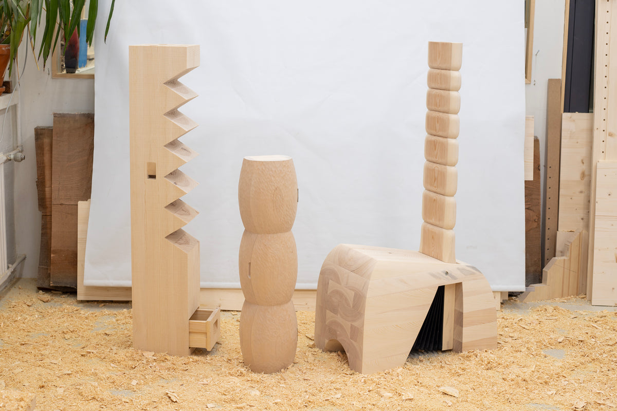 Sculptural wooden pieces from Hemmo Honkonen’s Audible Furniture, photographed in a workshop