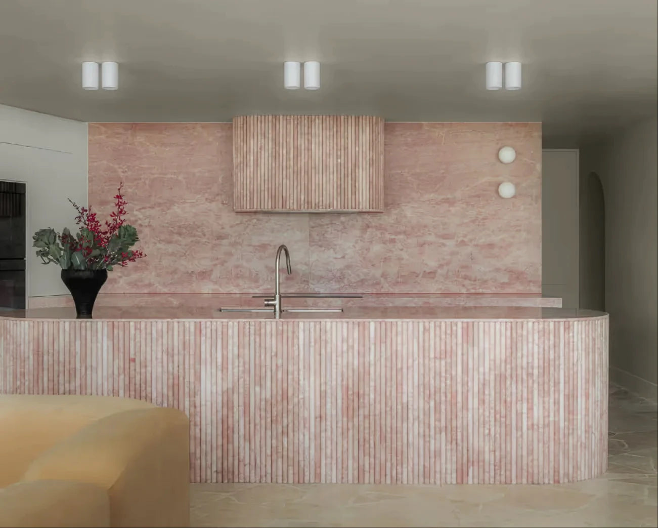 Warm pink natural stone kitchen backsplash