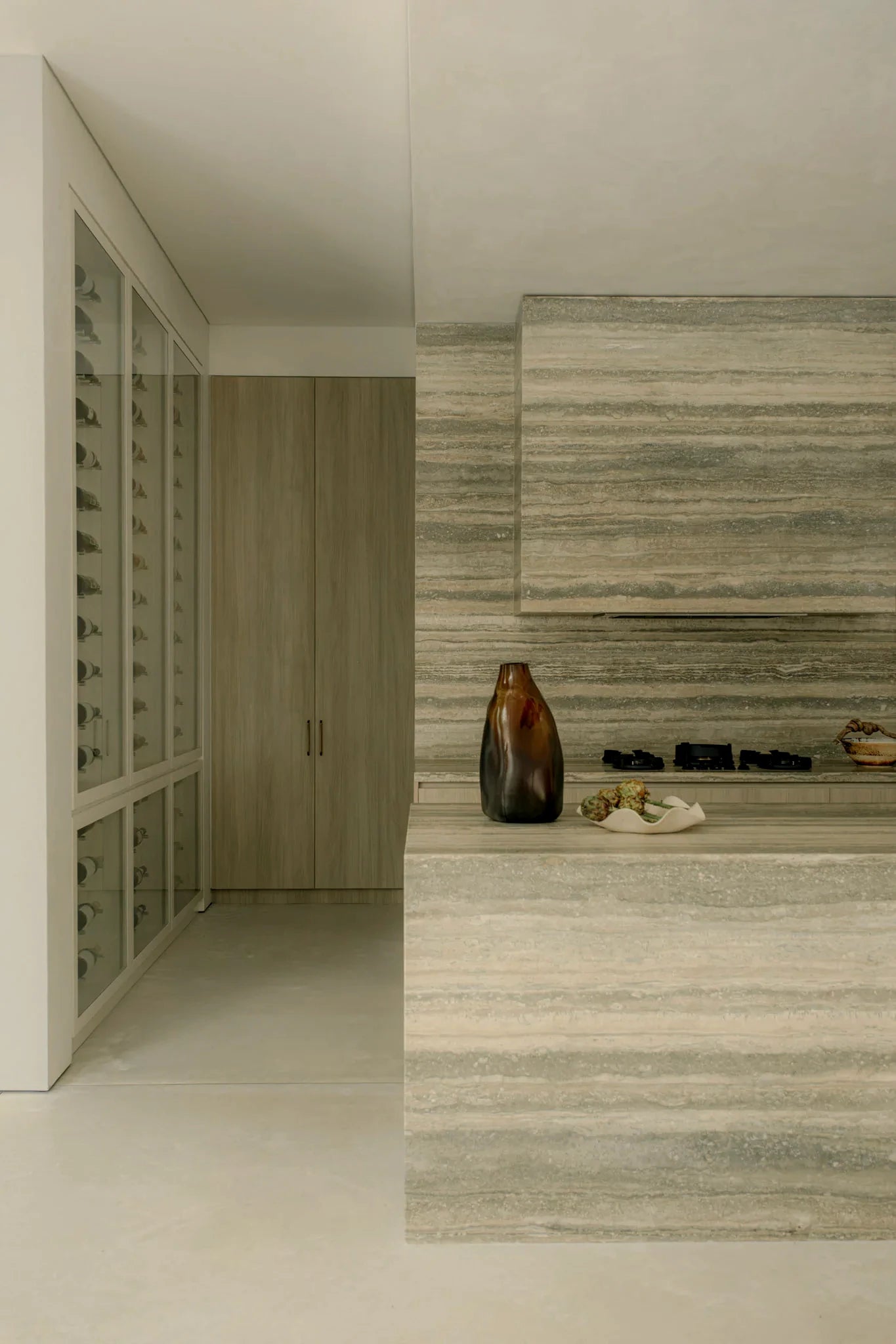 Natural stone kitchen island with layered stone movement
