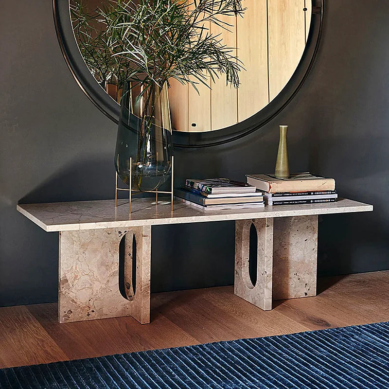 Natural stone console and mirror styled in a contemporary interior