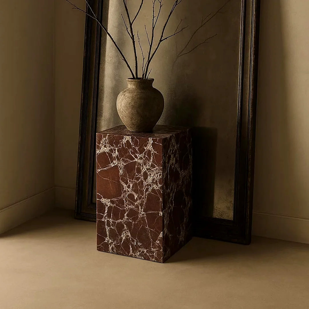 Red marble pedestal designed as a sculptural statement piece