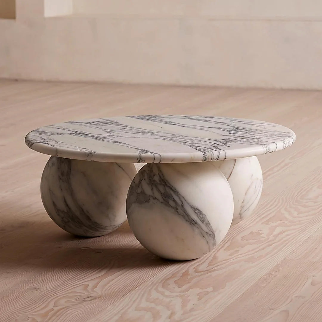Sculptural marble coffee table forming a statement piece in a contemporary interior