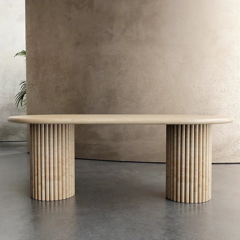 Sculptural natural stone bench with carved architectural form