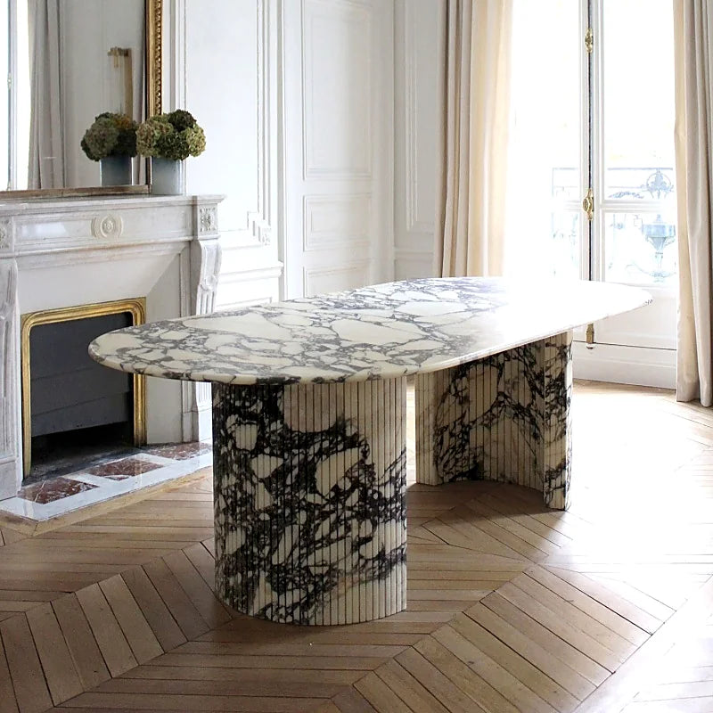 Natural stone console positioned beside a window in a light-filled interior
