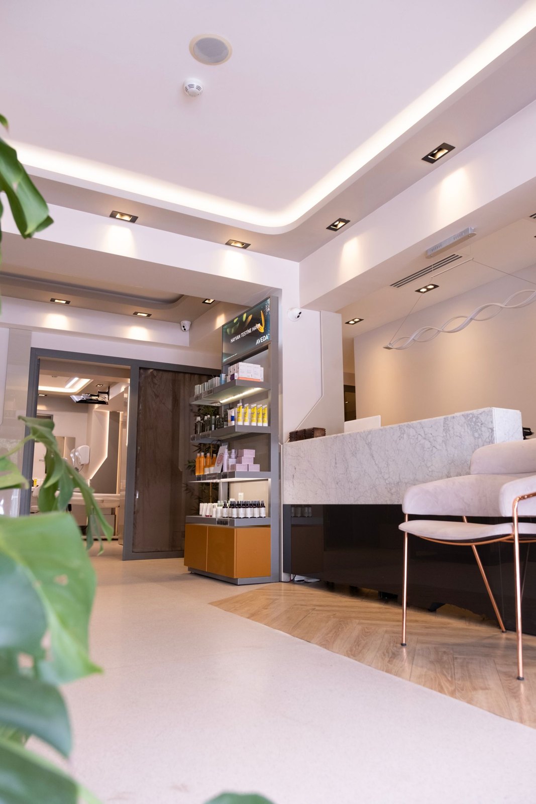 Spa reception with pale counter, timber details and waiting seats