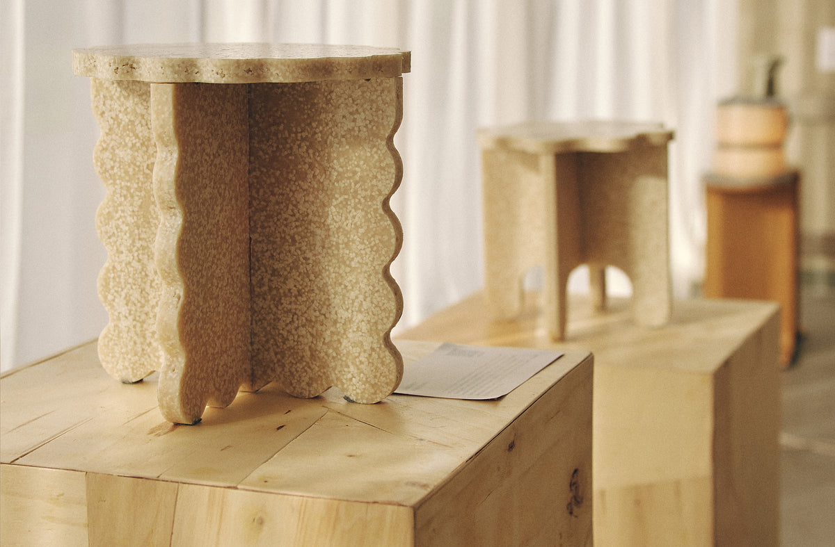 Textured biopolymer stool with curved edges by MOZI Studio