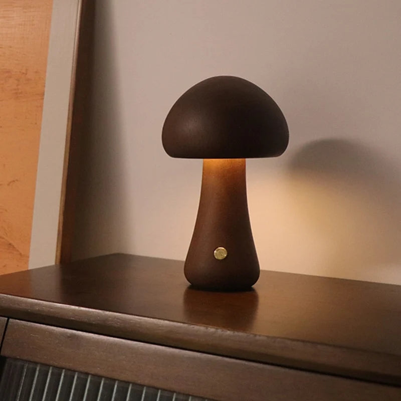 Collection of glowing mushroom lamps in dark and natural wood finishes
